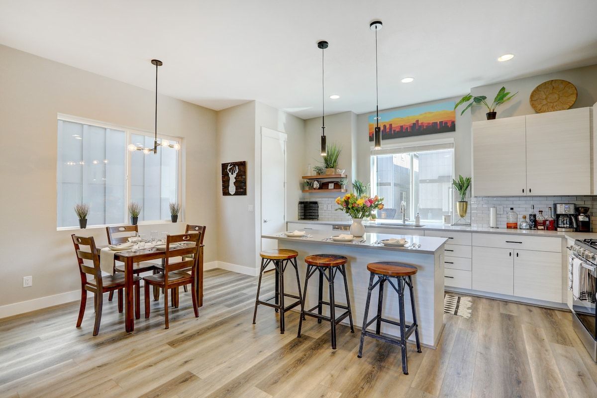 Kitchen and dining area under pendant lighting