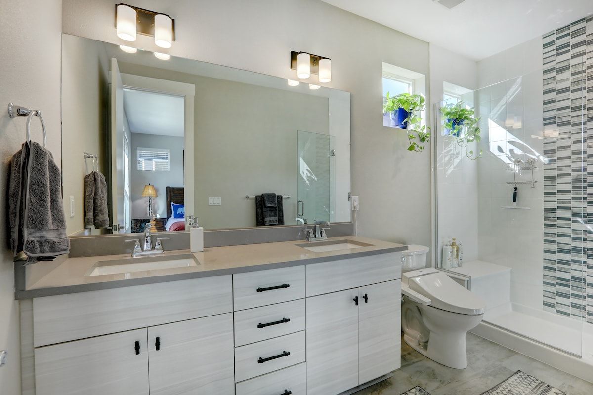 Double-vanity bathroom with a tiled shower
