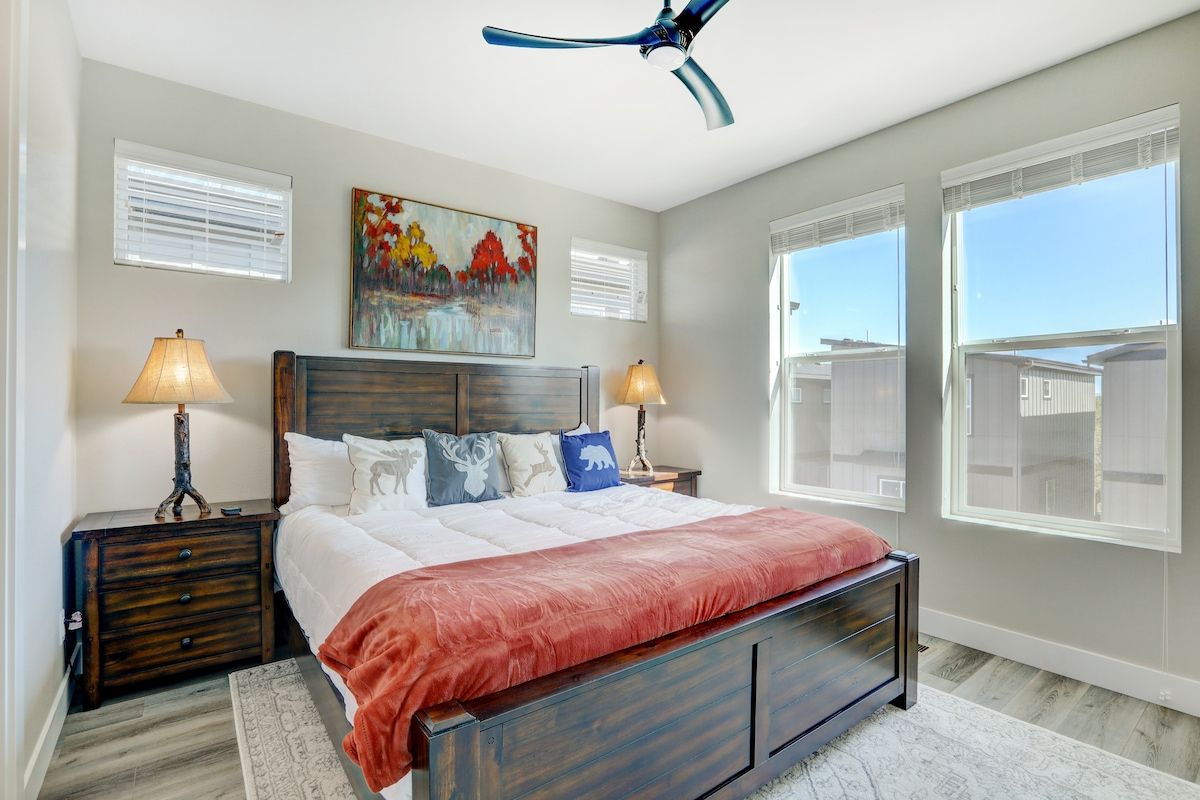 Primary bedroom with a king bed and large windows