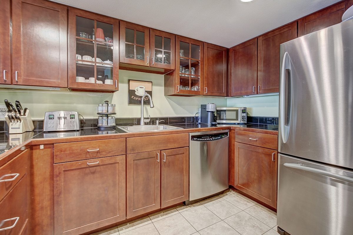 Kitchen with cherry cabinets and stainless appliances