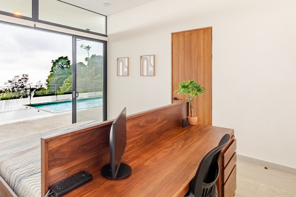 Desk and workspace looking out to the pool